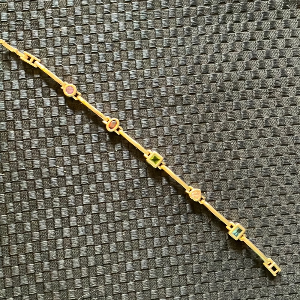 Gold-tone station bar bracelet with gemstones 7” with fold over clasp